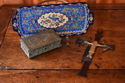 a cross, a box, and a cross on a wooden table