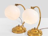 pair of brass table lamps with frosted glass globe shades