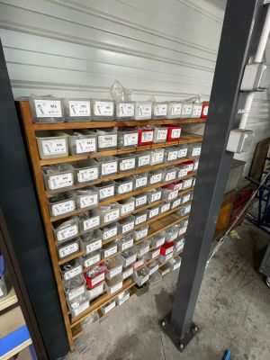 many boxes on the shelves in the garage