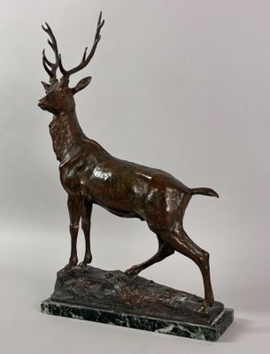 bronze sculpture of a stag on a marble base
