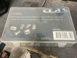 a box of screws sitting on a table next to a pair of scissors