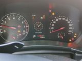 a close up of a car dashboard with a speedometer and gauges
