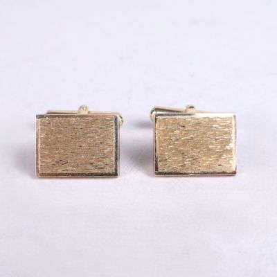 gold plated square cufflinks with a textured surface