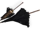 two umbrellas that have been left on the ground