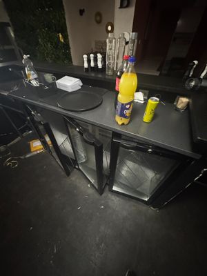 a table with drinks and condiments on top of it