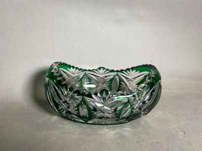 an image of a green glass bowl sitting on a white surface