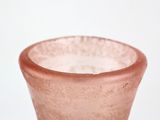 a pink vase with a white background on the table