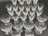 a lot of empty wine glasses sitting on a table