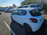 a white car that is parked in a parking lot