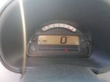 a close up of a car dashboard with a speedometer
