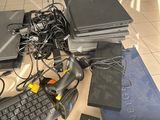 a lot of electronics on the floor of this room
