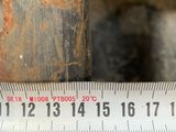 a measuring tape that is on a piece of wood