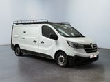 the white van is parked in a large room with a black roof rack