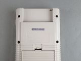 a white nintendo game console sitting on a table