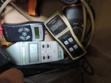 several electronic devices are sitting in a bag on a table