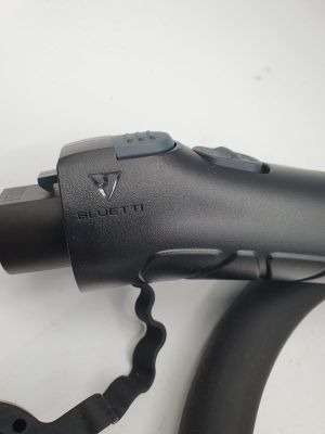 a black blow dryer sitting on top of a white table