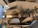 a cardboard box filled with assorted items in a garage