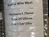 a roll of wire mesh wrapped in plastic on top of a pallet