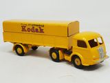 yellow toy truck with a box on the back of it on a white surface