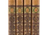 a set of four antique books sitting on top of each other