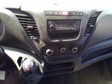 the dashboard of a car with a radio and a steering control
