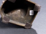 a close up of a metal object with a tag on it