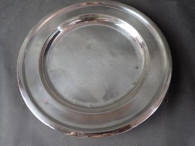 a silver plate that is sitting on a table