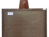 an old wooden easel with a blackboard and a piece of wood