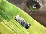 a close up of a purse that has a tag on it
