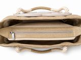 the inside of a bag with a laptop and a phone inside of it