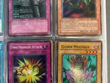 four different pokemon cards are in a plastic case on a table