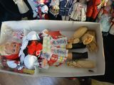 a doll in a box with other dolls in the background