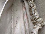 a close up of a purse with a zipper on it