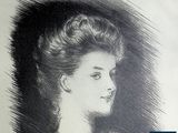 portrait of a woman in profile with her hair in a bunt