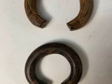 three pieces of carved wood sit on top of a table