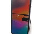an image of a close up of a cell phone on a stand
