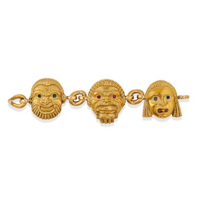 a close up of three gold bracelets with different colored stones
