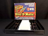 a box of dice - u - matic on a black table