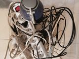 a pile of electrical cords and wires on the floor