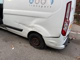 a van that is parked in a parking lot with its door open