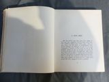 an open book with a picture of a cat on it