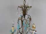 an image of a chandelier with three lights hanging from it ' s ceiling