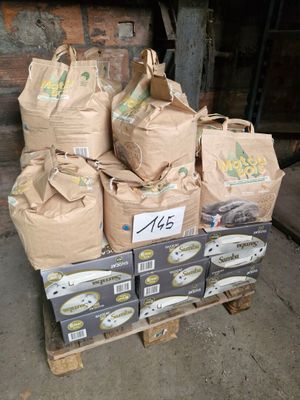 many bags of food sitting on top of a pallet