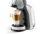 une image d'une machine à café avec une tasse de café