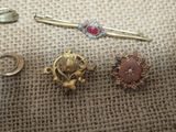 three different types of brooches on a table