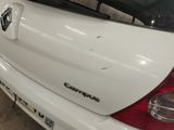 a white car that is parked in a garage