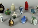 a lot of small vases that are sitting on a table