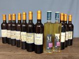 bottles of wine are lined up on a wooden table