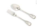 two forks and spoons are sitting next to each other on a white surface