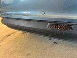 a close up of a car with a sticker on it ' s bumper